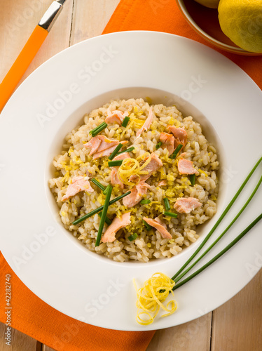 risotto with fresh salmon chive and lemon peel, healthy food