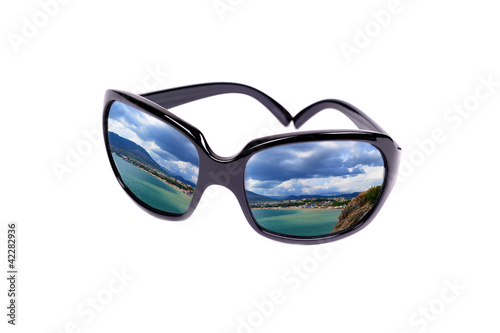 Reflection of the coast in glasses