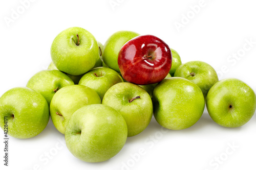red apple between green apples