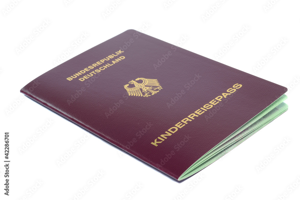 A German passport for a child closed on white background A German passport for a child closed on white background