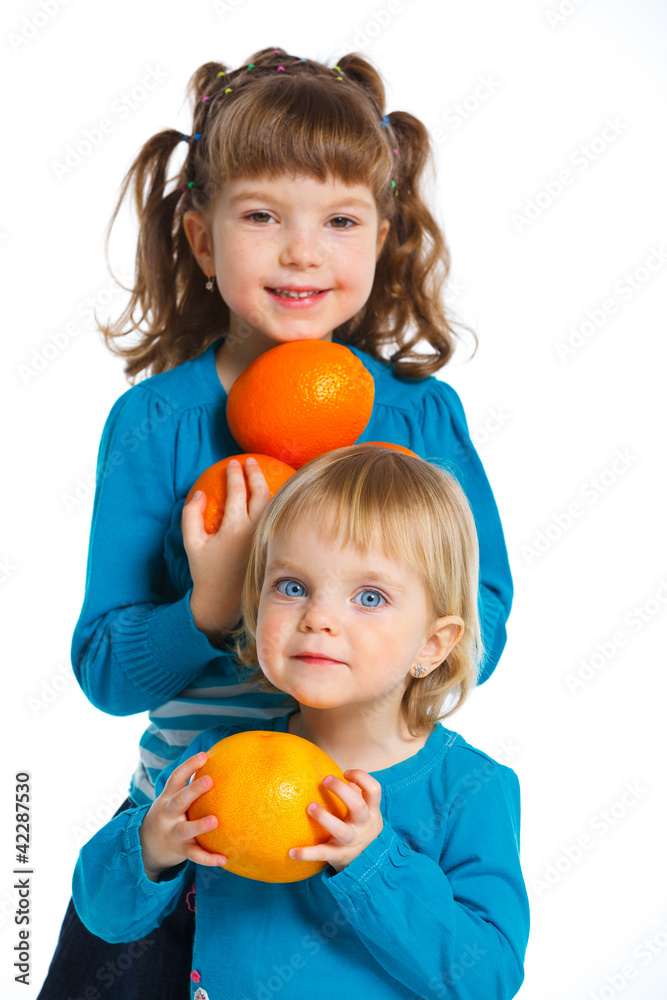 Happy girls with oranges Happy girls with oranges