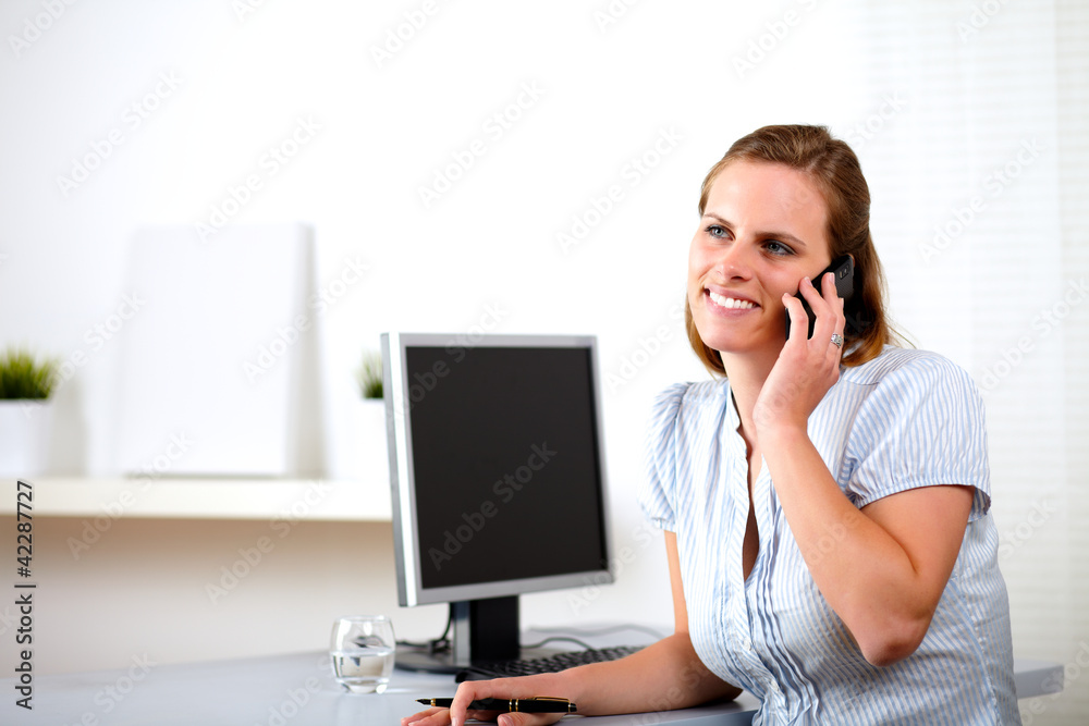 Caucasian businesswoman smiling and talking Caucasian businesswoman smiling and talking