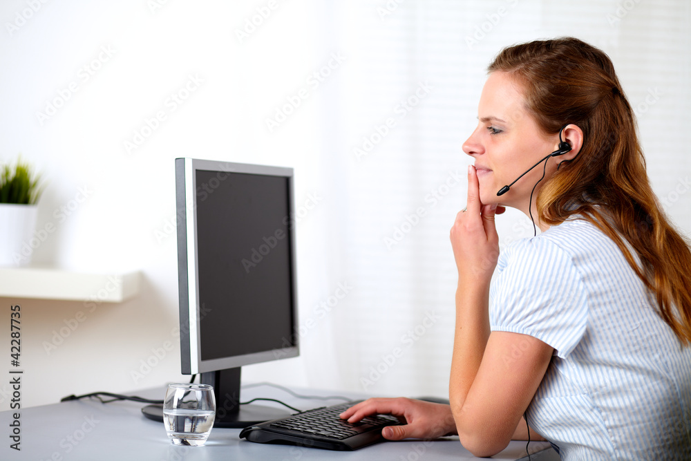 Blonde female receptionist on call center Blonde female receptionist on call center
