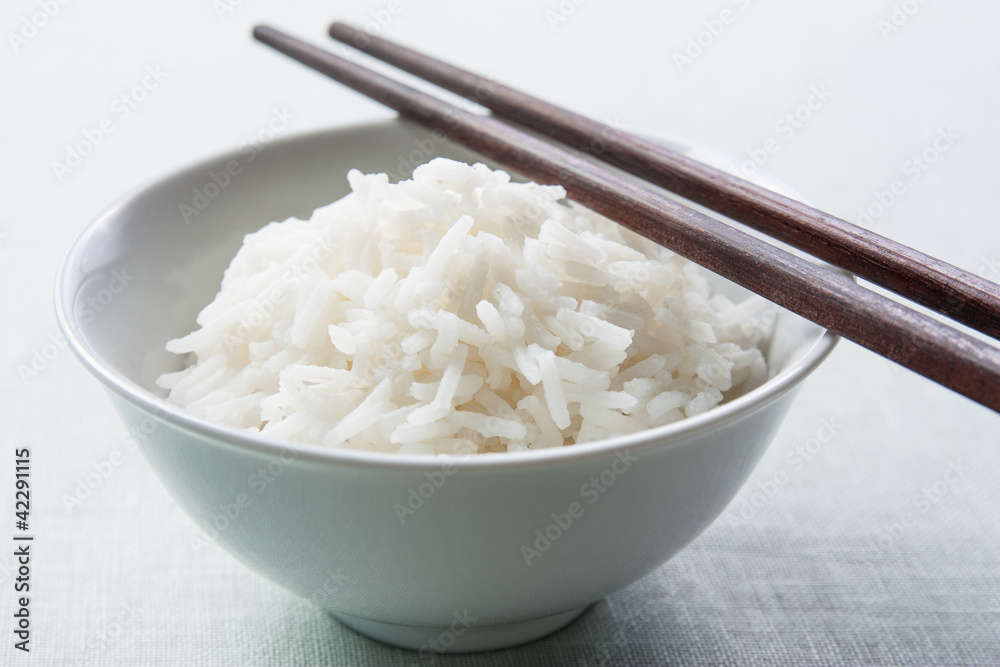 Long grain rice bowl with chopsticks