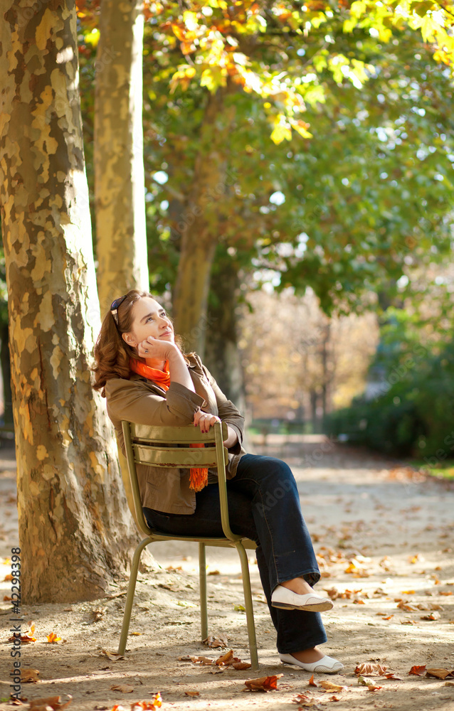Beautiful young woman enjoying warm autumn day Beautiful young woman enjoying warm autumn day