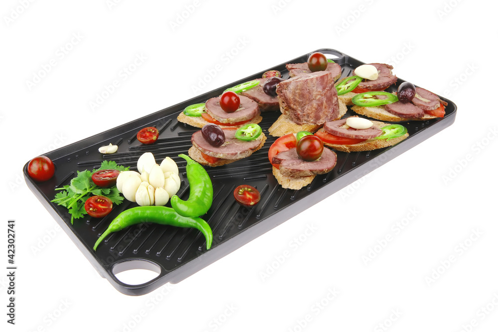 black teflon grill plate with meaty tartlets black teflon grill plate with meaty tartlets