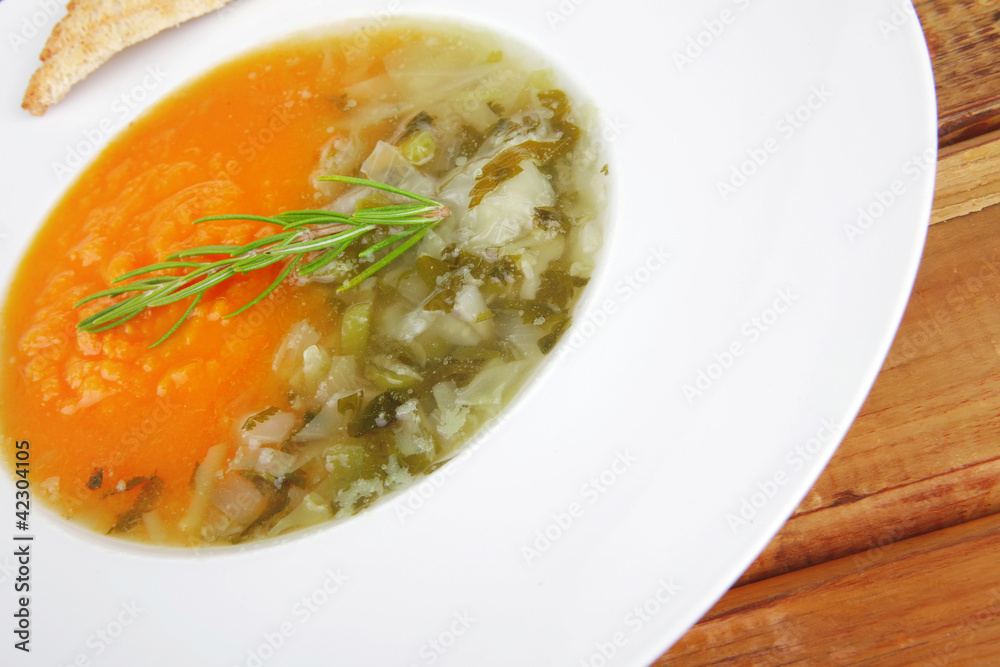 soup served with toasts on white dish soup served with toasts on white dish