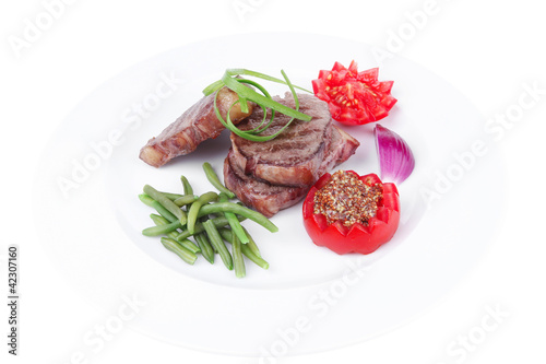 beef steaks strips on white plate
