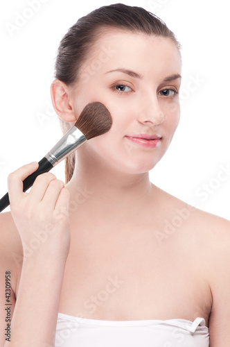 Beautiful woman with make up brush