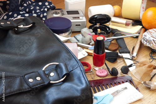 Mess in woman handbag