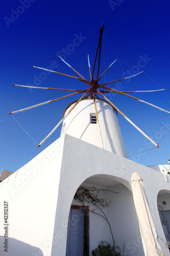 Santorini with old Windmill in Oia village, Greece