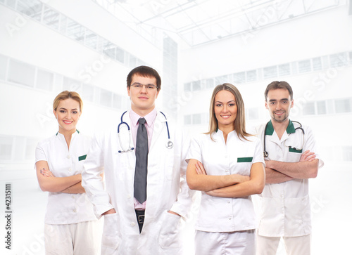 A team of young and smart medical workers in white clothes