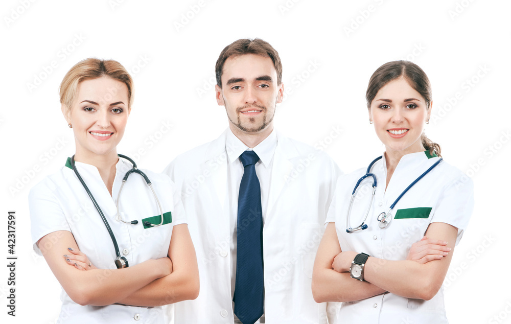 A team of three young Caucasian doctors in white clothes A team of three young Caucasian doctors in white clothes