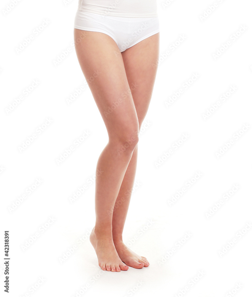 Sexy legs of a young woman in white panties on white Sexy legs of a young woman in white panties on white