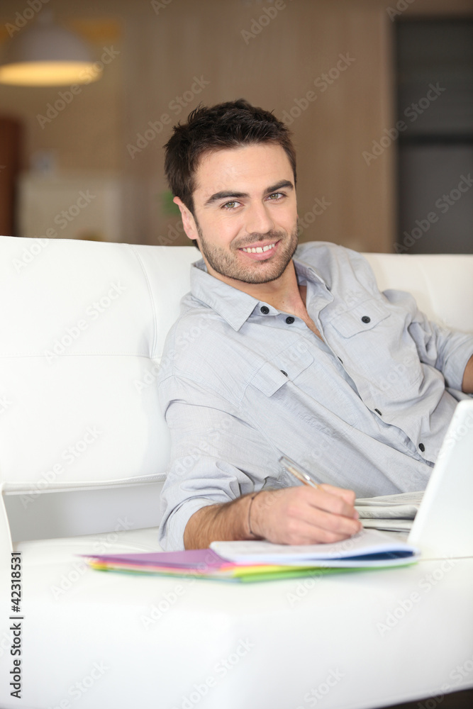 Smiling man on sofa Smiling man on sofa