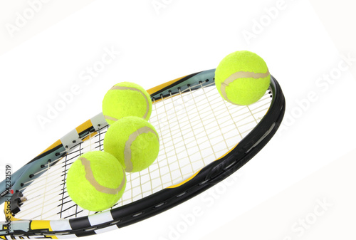Tennis racket and balls over white background