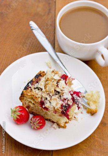 Biscuit cake with berries and sugar crust