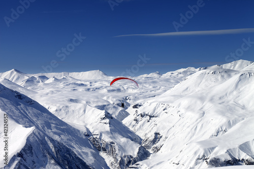 Sky gliding in snowy mountains