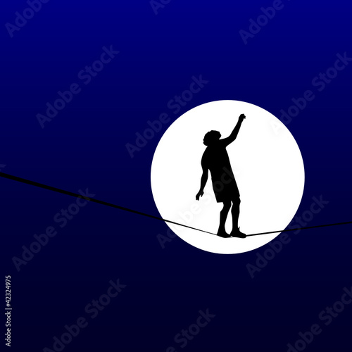 man walking a tightrope in the moonlight