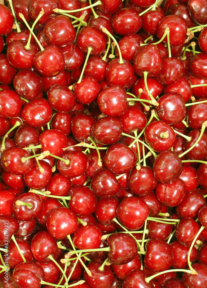background of red ripe cherries for sale at market background of red ripe cherries for sale at market