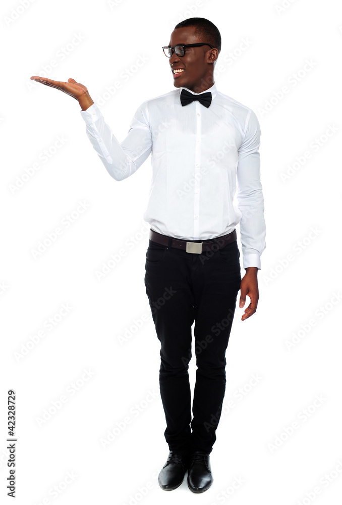 Smiling isolated man presenting copyspace Smiling isolated man presenting copyspace