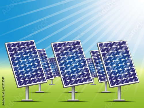 Solar panels on green field.