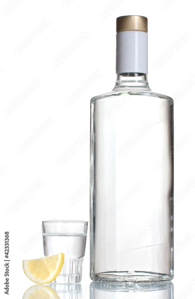 Bottle of vodka and wineglass with lemon isolated on white Bottle of vodka and wineglass with lemon isolated on white