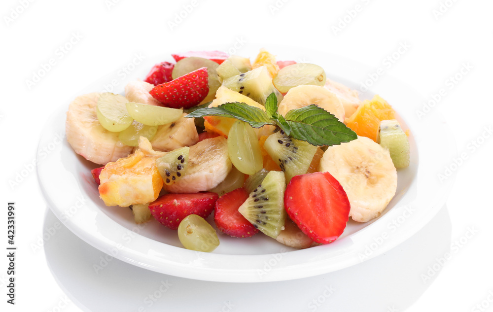 Fresh fruits salad on plate isolated on white