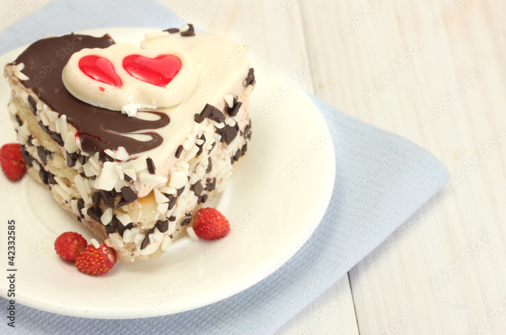sweet cake with chocolate on plate on wooden table sweet cake with chocolate on plate on wooden table