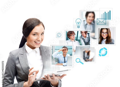 Portrait of businesswoman holding her tablet computer and commun photo