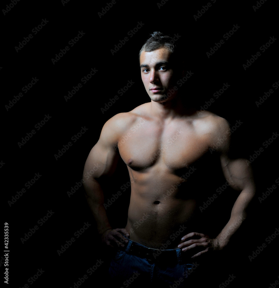 Fototapeta premium Bodybuilder showing his muscles