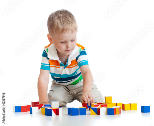 kid playing toy blocks