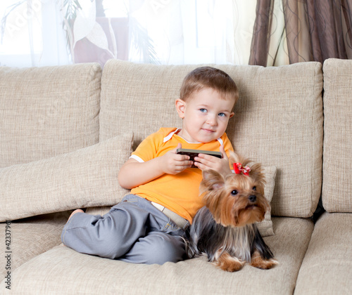 little boy  with loving dog...