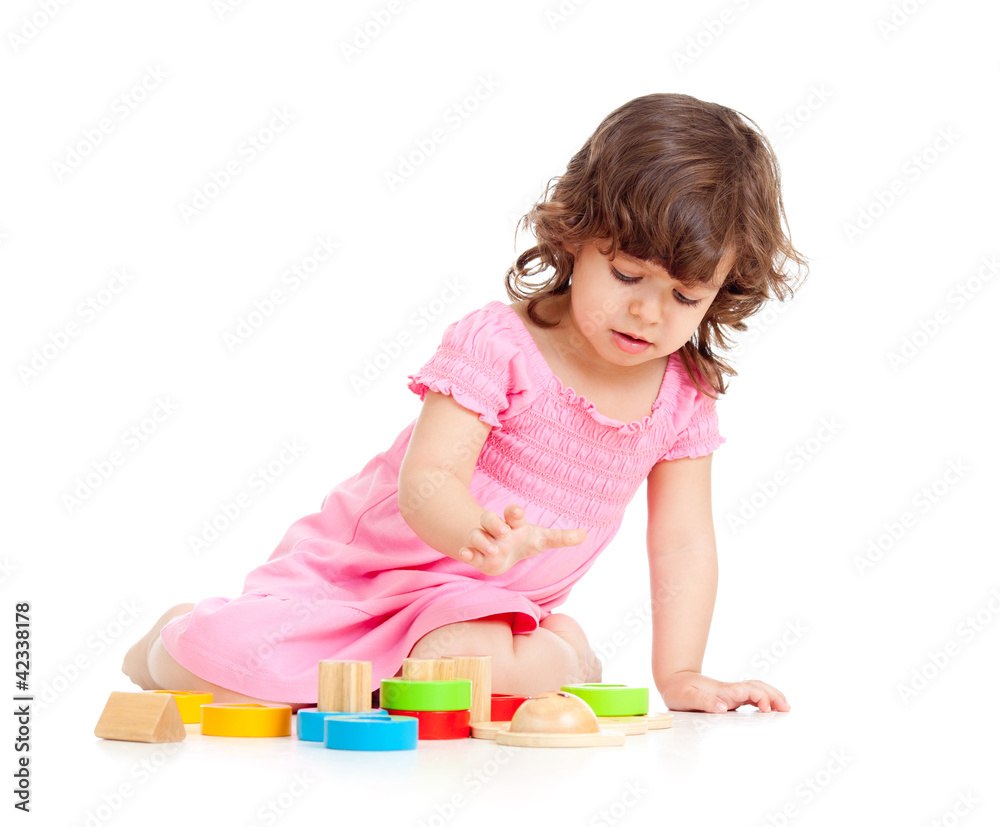 cute kid girl playing with colorful toys, isolated over white cute kid girl playing with colorful toys, isolated over white