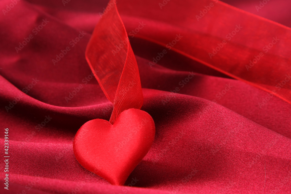 Invitation card on red silk satin background. Invitation card on red silk satin background.