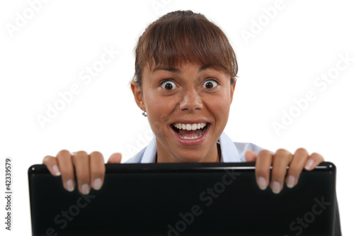 Canvas Print Excited woman with a laptop
