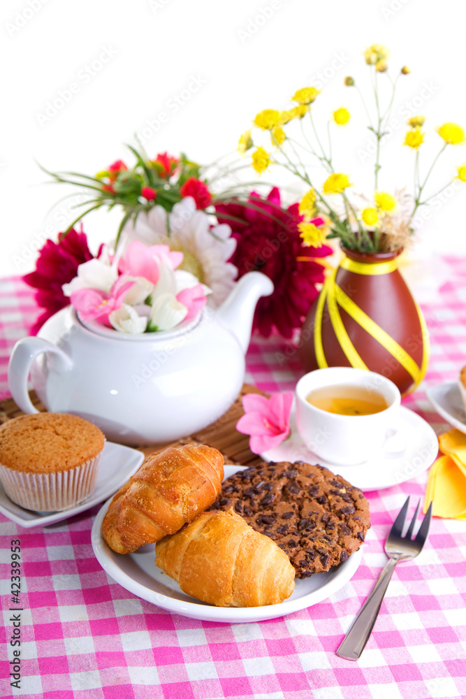 breakfest with tea, cake and yellow flowers breakfest with tea, cake and yellow flowers
