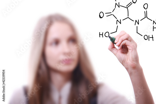 woman chemist shows a molecular structure