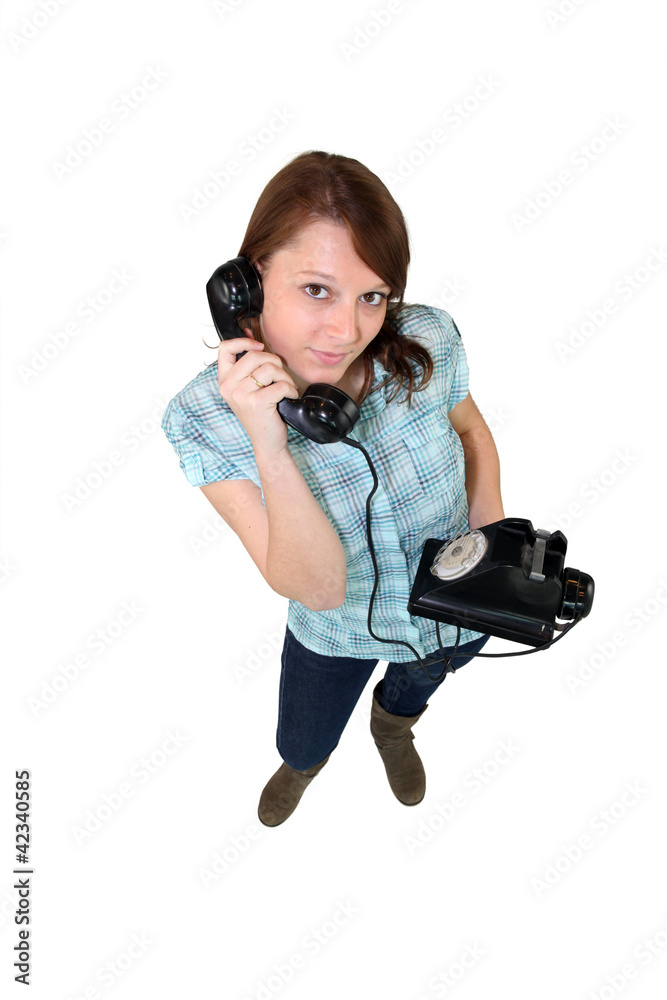 Young woman with a retro phone Young woman with a retro phone