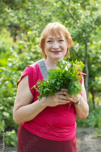 woman with  dill and parsley photo