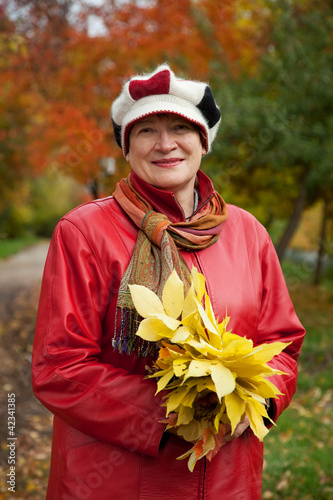 mature woman  in autumn park photo