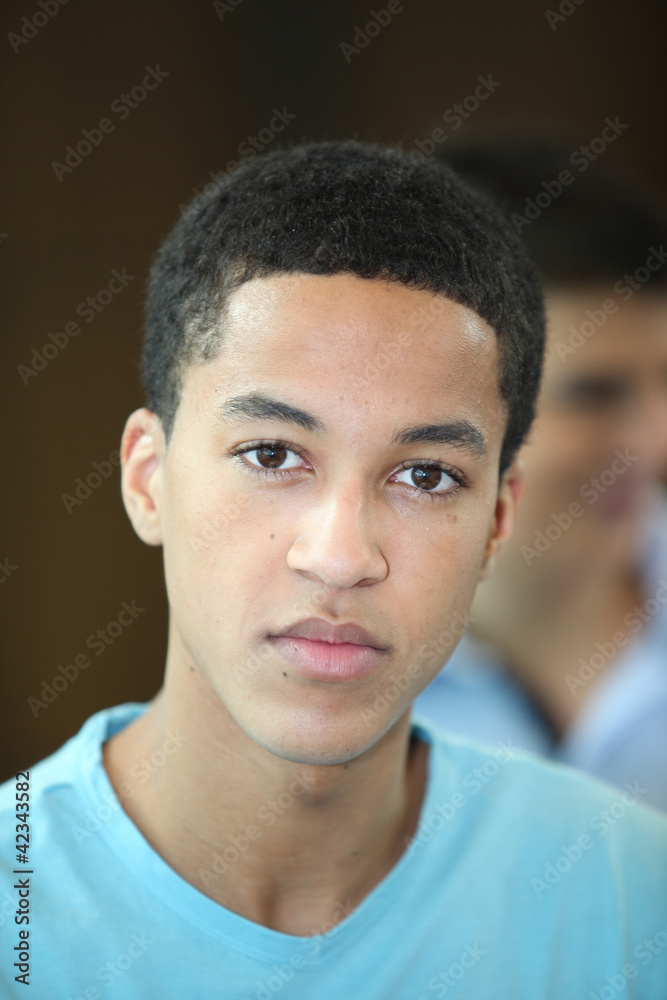 Portrait of a teenager with a neutral expression
