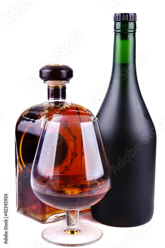 glass and bottles of brandy