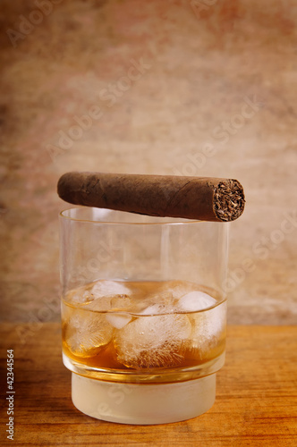 glass of whiskey and cigar