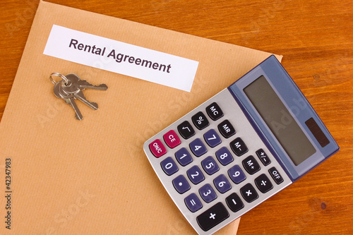 Rental agreement on wooden background close-up