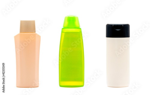 blank cosmetic bottles on white