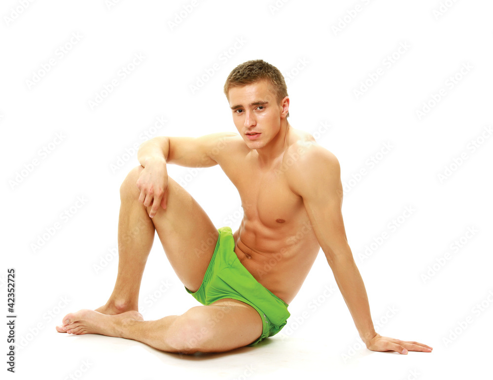 Happy smiling young fitness man