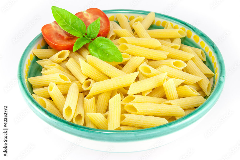 Bowl full of pens pasta with tomatoes and basil Bowl full of pens pasta with tomatoes and basil
