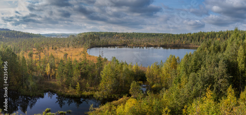 Kind on wood lakes from a hill, panorama