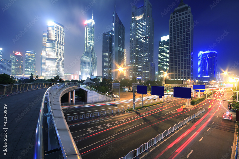 Urban at night with traffic and night skyline in shanghai China